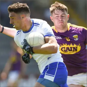  ??  ?? Naomhan Rossiter of Wexford tackling Waterford’s Shane Ryan in the All-Ireland SFC qualifier defeat.