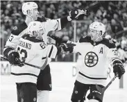  ?? John Locher / Associated Press ?? Brad Marchand, left, Zdeno Chara, top, and Patrice Bergeron have won the Stanley Cup with the Bruins.