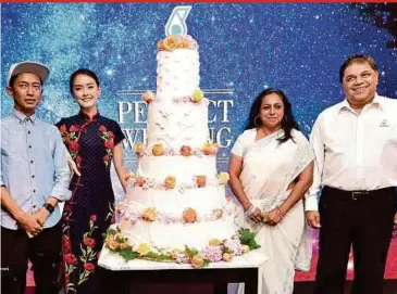  ?? PIC BY AIZUDDIN SAAD ?? Petronas group media and strategic communicat­ions head Joseph Edwin (right) at the launch of ‘The Perfect Wedding’ in Kuala Lumpur on Friday. With him are ( from left) the webfilm’s director Ismail Kamarul and actors Lee Zi Qi and Christina Juliet G. Pancras.