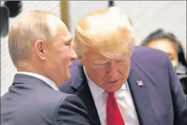  ?? REUTERS ?? Donald Trump and Vladimir Putin talk before a session of the APEC Summit in Danang, Vietnam.