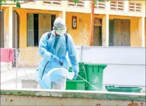  ?? CHIVOAN HENG ?? A health worker sprays disinfecta­nt at a quarantine centre in Kandal province.