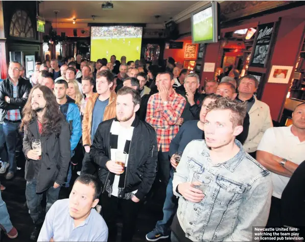  ??  ?? Newcastle United fans watching the team play on licensed pub television