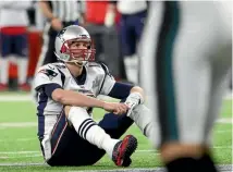  ?? GETTY IMAGES ?? Tom Brady sits dejectedly after fumbling the ball during the fourth quarter.