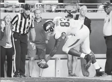  ??  ?? In for six: Arkansas tight end Jeremy Sprinkle (83) reaches over the pylon after catching a pass to score a touchdown in overtime against TCU during a game earlier this month in Fort Worth, Texas.