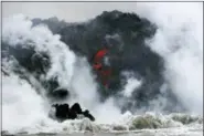  ?? JAE C. HONG — THE ASSOCIATED PRESS FILE ?? Lava flows into the ocean near Pahoa, Hawaii.