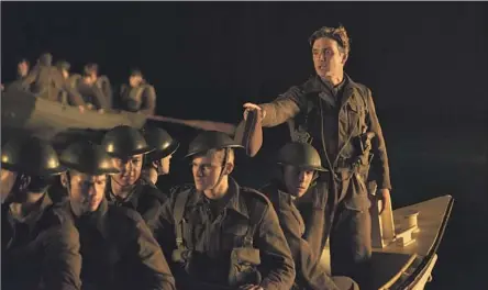  ?? Melinda Sue Gordon Warner Bros. Pictures ?? CILLIAN MURPHY, standing, in Christophe­r Nolan’s “Dunkirk,” a WWII story driven more by ideas than violence and carnage.