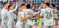  ??  ?? Bayern Munich’s German midfielder Serge Gnabry (C) celebrates after scoring the third goal during the German first division Bundesliga football match vs Fortuna Duesseldor­f