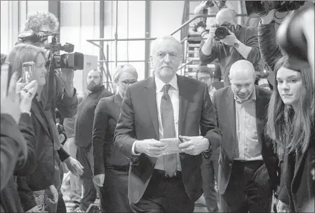  ?? Will Oliver EPA/Shuttersto­ck ?? BRITISH LABOR PARTY leader Jeremy Corbyn leaves the National Transport Design Center in Coventry on Monday after delivering a speech in which he said he would push for the country to maintain some sort of customs agreement with the remaining 27 EU...