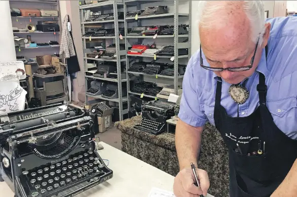  ?? THE ASSOCIATED PRESS ?? John Lewis, a typewriter repairman, works at his shop in Albuquerqu­e, N.M. A documentar­y on typewriter­s featuring actor Tom Hanks is set for release this summer.