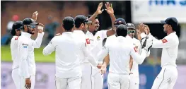  ?? Picture: GALLO IMAGES/ ASHLEY VLOTMAN ?? TEAM EFFORT: Sri Lanka celebrate the wicket of Dean Elgar of South Africa during day two of the second Test match against South Africa at St George’s Park in Port Elizabeth on Friday.
