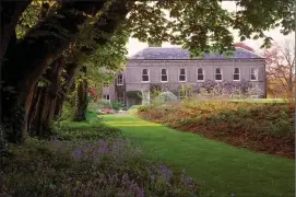  ??  ?? The award-winning Ballyvolan­e House and a section of its stunning gardens. Photo: James Fennell.