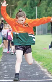  ??  ?? Alyssa Hartland gives it everything she’s got in her girls under 8 long jump event.