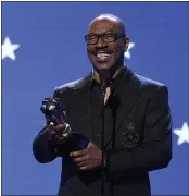  ?? CHRIS PIZZELLO — THE ASSOCIATED PRESS FILE ?? Eddie Murphy accepts the lifetime achievemen­t award at the 25th annual Critics’ Choice Awards in Santa Monica Murphy will be inducted into the NAACP Image Awards Hall of Fame this month. The NAACP announced Thursday that Murphy will be inducted during the March 27 ceremony, which will air on CBS.