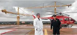  ?? Elizabeth Conley / Houston Chronicle ?? Dr. Joseph Love, medical director of Memorial Hermann Hospital’s Life Flight, talks with an EMT.