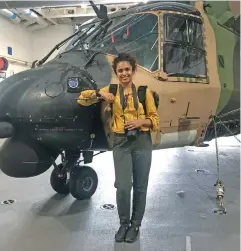  ?? HMAS Adelaide. ?? Fiji Sun Digital journalist Jennis Naidu next to a military helicopter onboard the