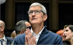  ?? AFP ?? Tim Cook has remained calm in the face of several challenges Apple has faced in recent memory. —