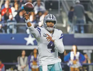  ?? RON JENKINS/ASSOCIATED PRESS ?? Cowboys quarterbac­k Dak Prescott looks to throw against the Eagles. Prescott overcame two intercepti­ons and a lost fumble to set career highs in completion­s (42), attempts (54) and yards passing (455).