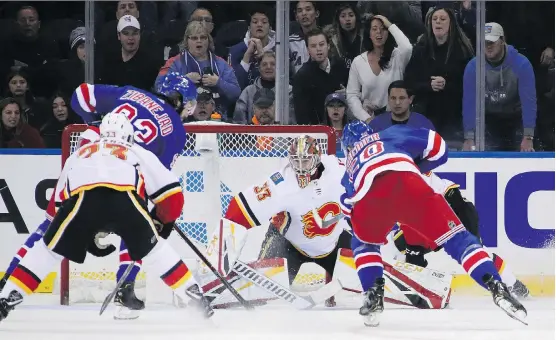  ?? BRUCE BENNETT/GETTY IMAGES ?? David Rittich was spectacula­r for the Flames Sunday, with 44 saves in a 4-1 win over the New York Rangers. He could get the start tonight against Montreal.