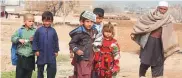  ??  ?? Refugees walk in the Kabobayan refugee camp, Peshawar, Pakistan.