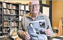  ?? BECKY JACOBS/POST-TRIBUNE ?? Bruce Woods holds a photo of Lillian Holley, the first female sheriff in Lake County, in this 2016 file photo.