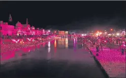  ?? ?? Devotees light lamps on 'Deepotsav' at Ramghat on the eve of 'Bhoomi Pujan' of the Ram temple in Ayodhya on Tuesday.