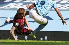  ??  ?? LIFT OF THE GAB: Gabriel Jesus is airborne after the force of Cooper’s challenge