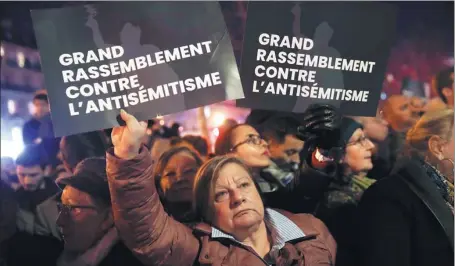  ?? CHRISTOPHE ENA / ASSOCIATED PRESS ?? People gather at the Republique Square in Paris to protest against anti-Semitism on Tuesday.
