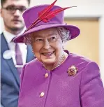  ?? Picture: Richard Pohle - WPA Pool/getty Images ?? Queen Elizabeth II talks to staff at the Ministry of Defence medal office at Imjin barracks on November 5, 2015