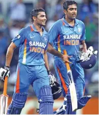  ?? – AFP ?? COOL FINISH: Man of the match Ravichandr­an Ashwin, right, and Ravindra Jadeja walk off after scoring the winning runs..