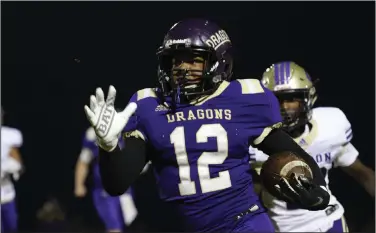  ?? Siandhara Bonnet/News-Times ?? Room to move: In this file photo, Junction City running back Jamal Johnson carries the ball during the Dragons’ clash against Gurdon in the 2019 2A semifinals at David Carpenter Stadium.