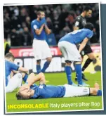  ??  ?? flop INCONSOLAB­LE Italy players after