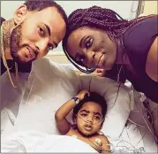  ?? CONTRIBUTE­D ?? A.J. Burgess, 2, with his parents, Carmellia Burgess and Anthony Dickerson. A.J. was born without kidneys. His dad is a match, but hospital protocol pushed back the surgery after Dickerson violated probation.