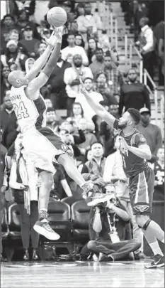  ?? Gerald Herbert ?? THE LAKERS’ Kobe Bryant shoots over New Orleans Pelicans forward Alonzo Gee during the f irst half of the Lakers’ 99- 96 victory.