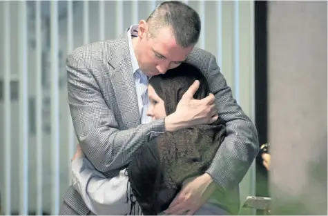  ?? DARRYL DYCK/CANADIAN PRESS ?? John Nuttall and Amanda Korody embrace each other at B.C. Supreme Court in Vancouver on Friday after a judge ruled the couple were entrapped by the RCMP in a police-manufactur­ed crime.