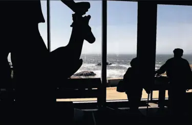  ?? Photos by Michael Macor / The Chronicle ?? The western side of the 4,100-square-foot structure looks out over Seal Rocks. The Diana statue (left) from 1886, which used to sit at the front of Sutro Baths, now stands inside the building’s visitors center.