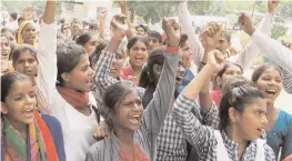  ?? — PTI ?? Girl students protest over their demand for upgradatio­n of the secondary school at Mujedi village in Faridabad.
