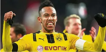  ??  ?? How’s that?: Borussia Dortmund’s Pierre-Emerick Aubameyang celebrates after scoring against Bayern Munich in the Bundesliga match on Saturday. Dortmund won 1-0. — EPA