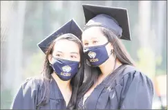  ??  ?? From left, Carylin Rivera of Stamford and Nichole Roldan of Stamford celebrate their graduation.