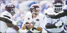  ?? David Stephenson / Associated Press ?? Former Xavier standount Tim Boyle, center, pictured here playing for Eastern Kentucky on Sept. 9, is ecstatic about signing with the Green Bay Packers.