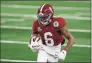  ?? Roger Steinman / Associated Press ?? Alabama wide receiver DeVonta Smith gains yardage after a catch in the first half of the Rose Bowl against Notre Dame on Friday.