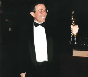  ?? (Courtesy) ?? RABBI MARVIN HIER and his Academy Award in 1997.