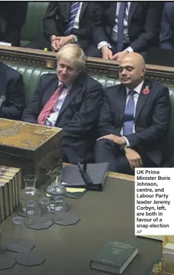  ??  ?? UK Prime Minister Boris Johnson, centre, and Labour Party leader Jeremy Corbyn, left, are both in favour of a snap election