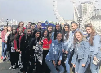  ??  ?? Capital gain The excited group get a great view of the London Eye while on Westminste­r Bridge