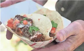  ?? JENNIFER CHANDLER/THE COMMERCIAL APPEAL ?? The Southern Fried Chicken Taco from El Mero Taco food truck is stuffed with crispy fried chicken, queso blanco, in-house pickled jalapenos, tomatoes and cilantro.