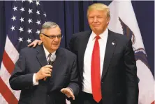  ?? Mary Altaffer / Associated Press 2016 ?? Then-Republican presidenti­al candidate Donald Trump is joined by Joe Arpaio at a campaign event in Iowa.