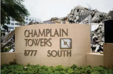  ?? Miami-Dade Fire Department ?? Days after the failure, a mound of wreckage rose above the sign that once beckoned residents and visitors.