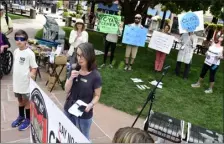  ?? CLIFF GRASSMICK/STAFF PHOTOGRAPH­ER ?? Lyons Mayor Hollie Rogin speaks to a crowd during a rally in Boulder where people were protesting the pollution created by the CEMEX Cement Plant in Lyons.