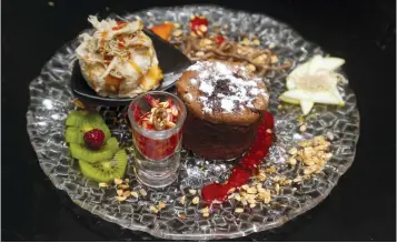  ??  ?? A TANTALIZIN­G DESSERT plate at a Jerusalem eatery.