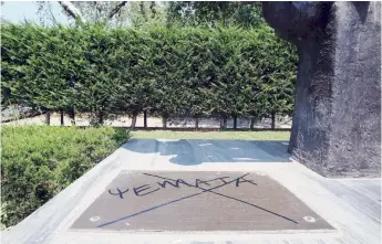  ??  ?? The word ‘lies’ is spray-painted on the Holocaust memorial in Athens. Memorials to Greek Jews often fall victim to vandalism.