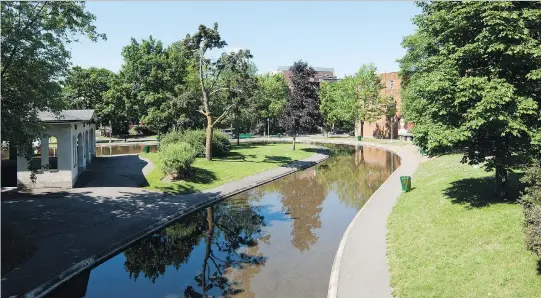  ?? PHOTOS COURTESY OF THE BOROUGH OF OUTREMONT ?? St-Viateur Park, one of the many parks and green spaces in Outremont, includes a meandering stream and a white stucco pavilion that faces a lagoon.